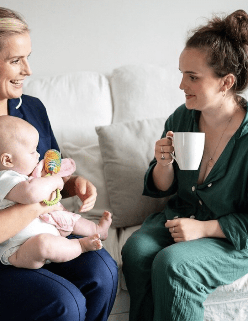 Midwife supporting mum