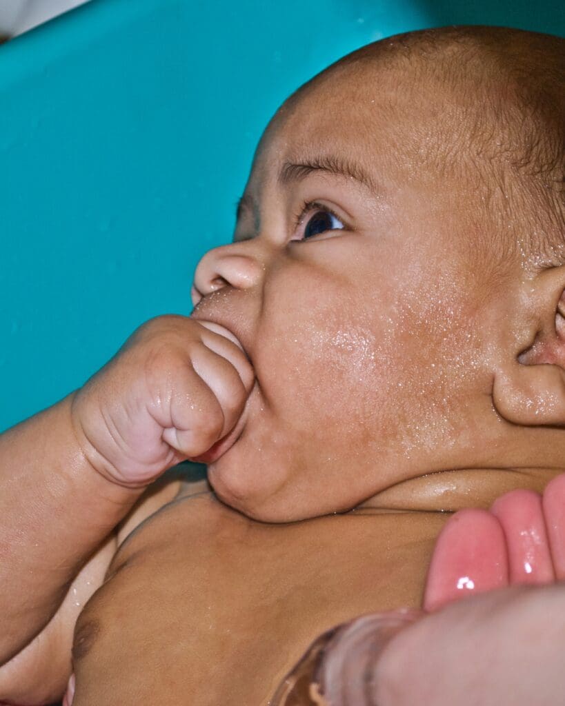 baby showing early feeding cue