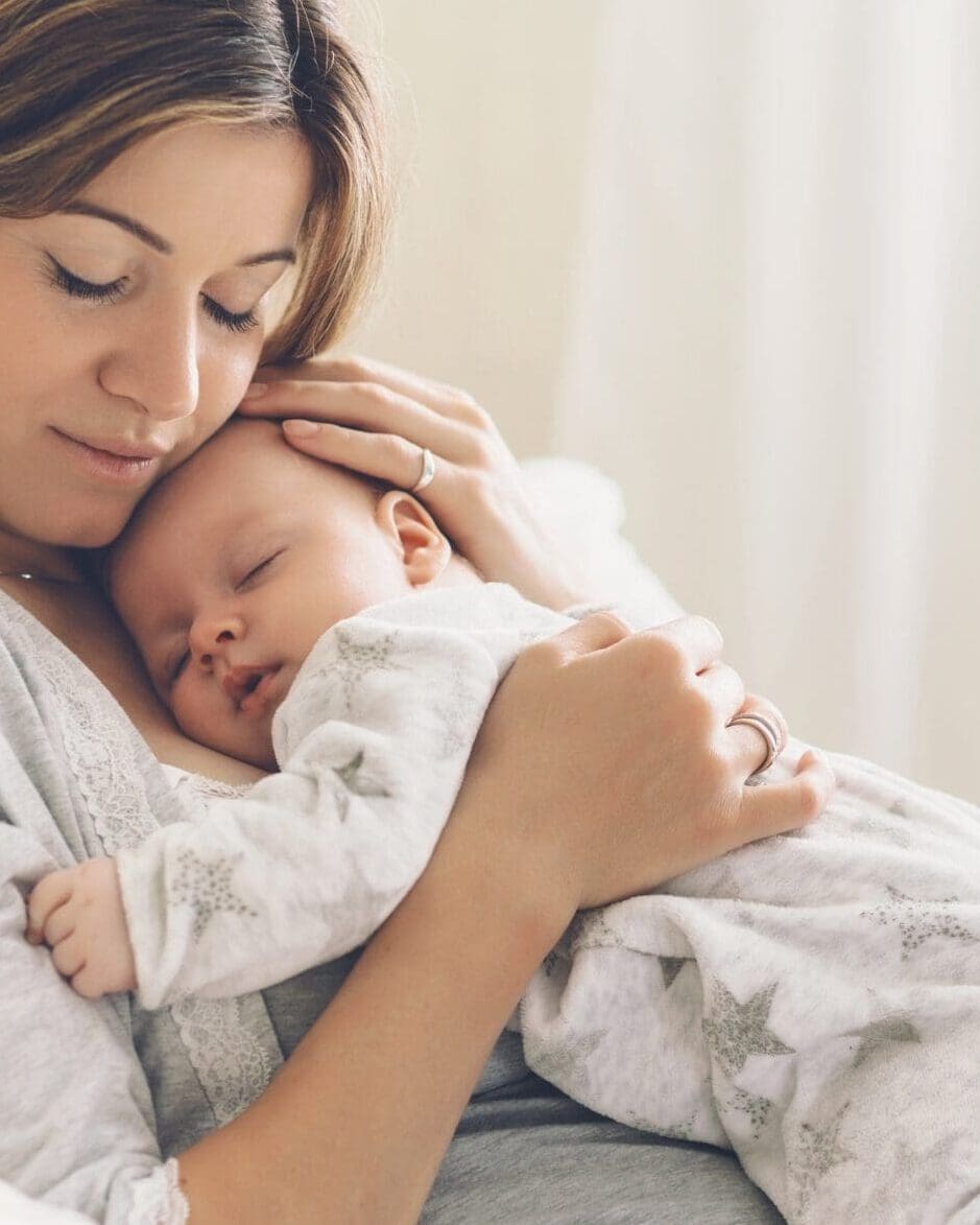baby asleep on mums chest