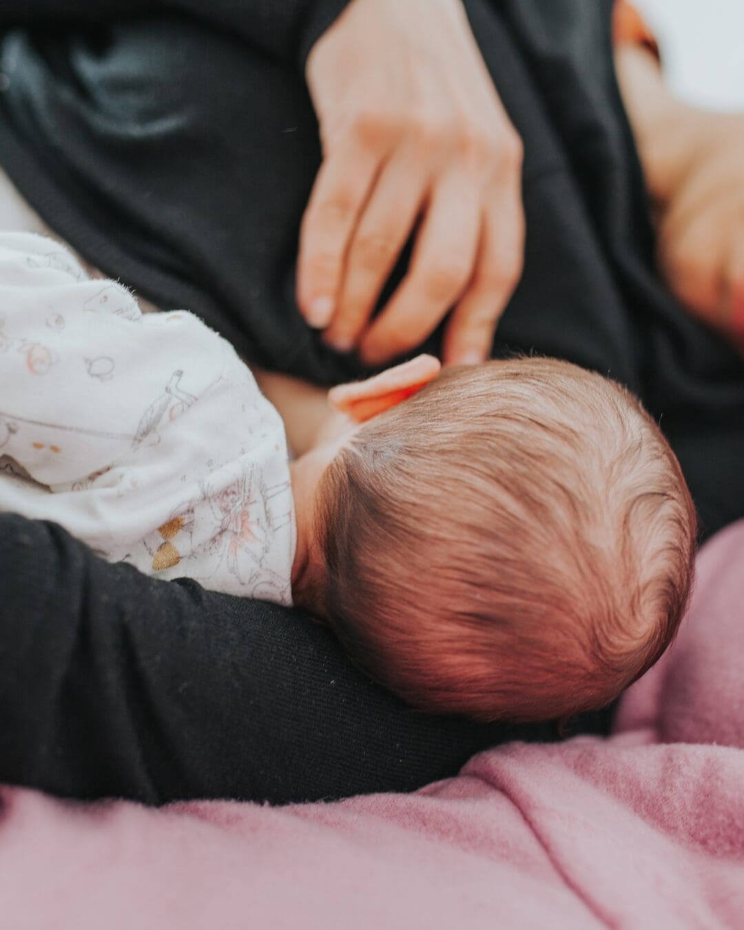 Baby sidelying breastfeeding pain free and happy